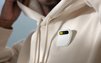 The AI Pin clips onto your shirt and beams out a tiny projector onto your head